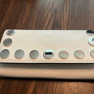 Michael Kors great condition two spots one inside one in picture outside pen?